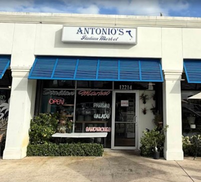 The Antonio's family in front of the Juno Beach storefront