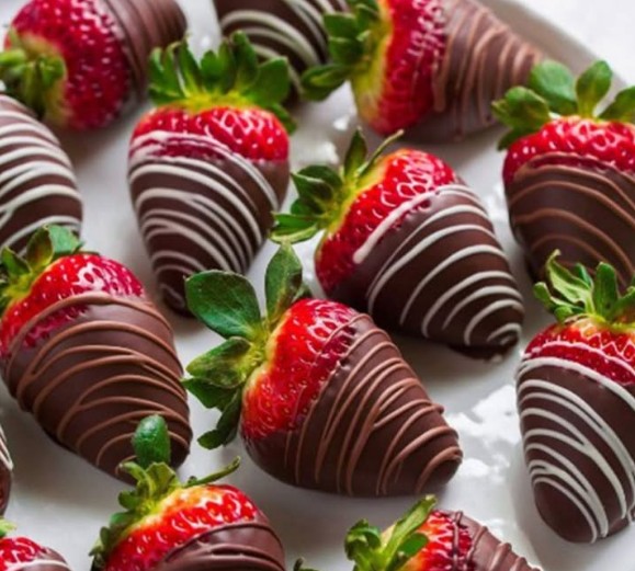 Chocolate-covered strawberries arranged on a tray
